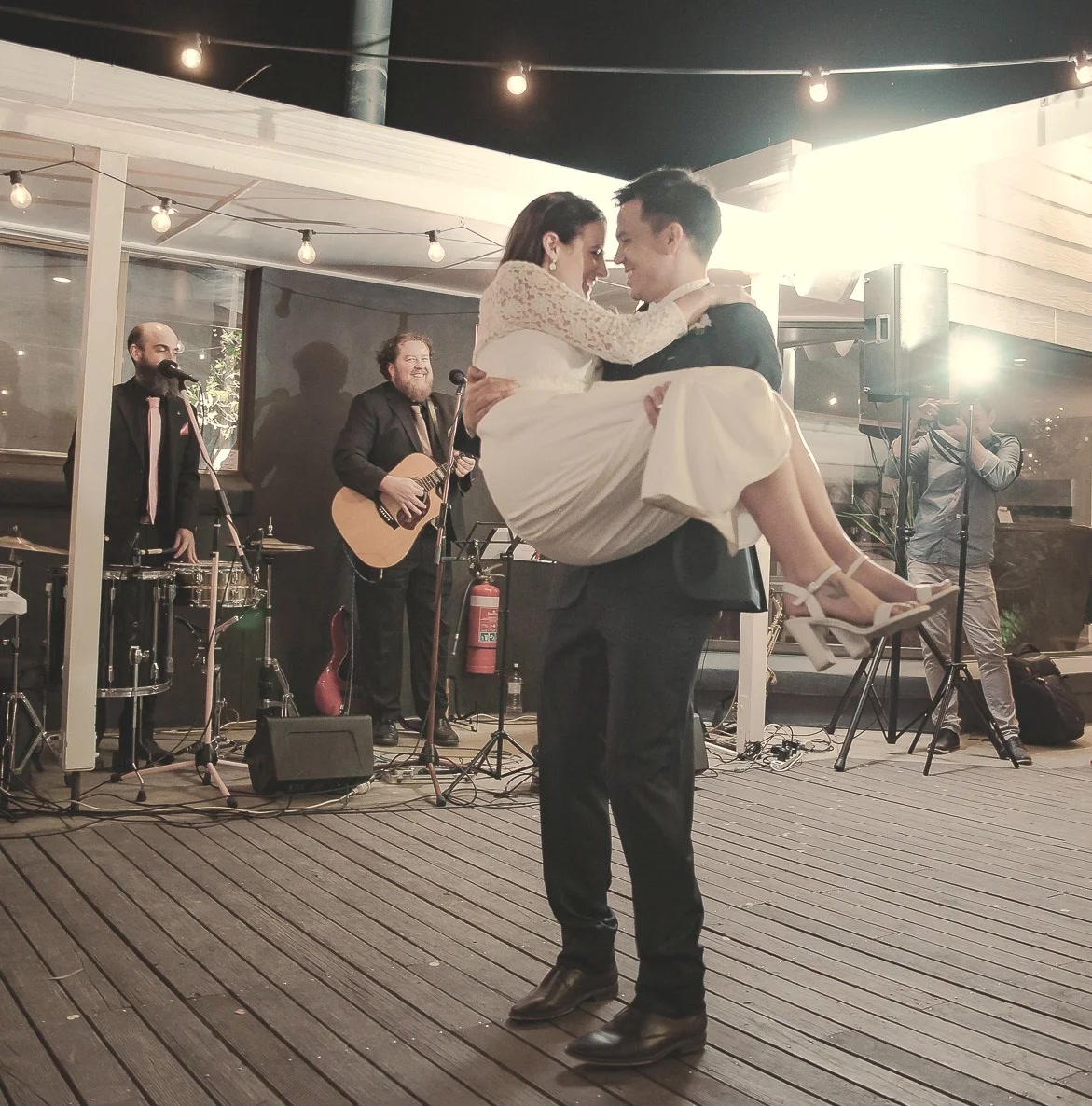 Couple dancing with The Neapolitans performing